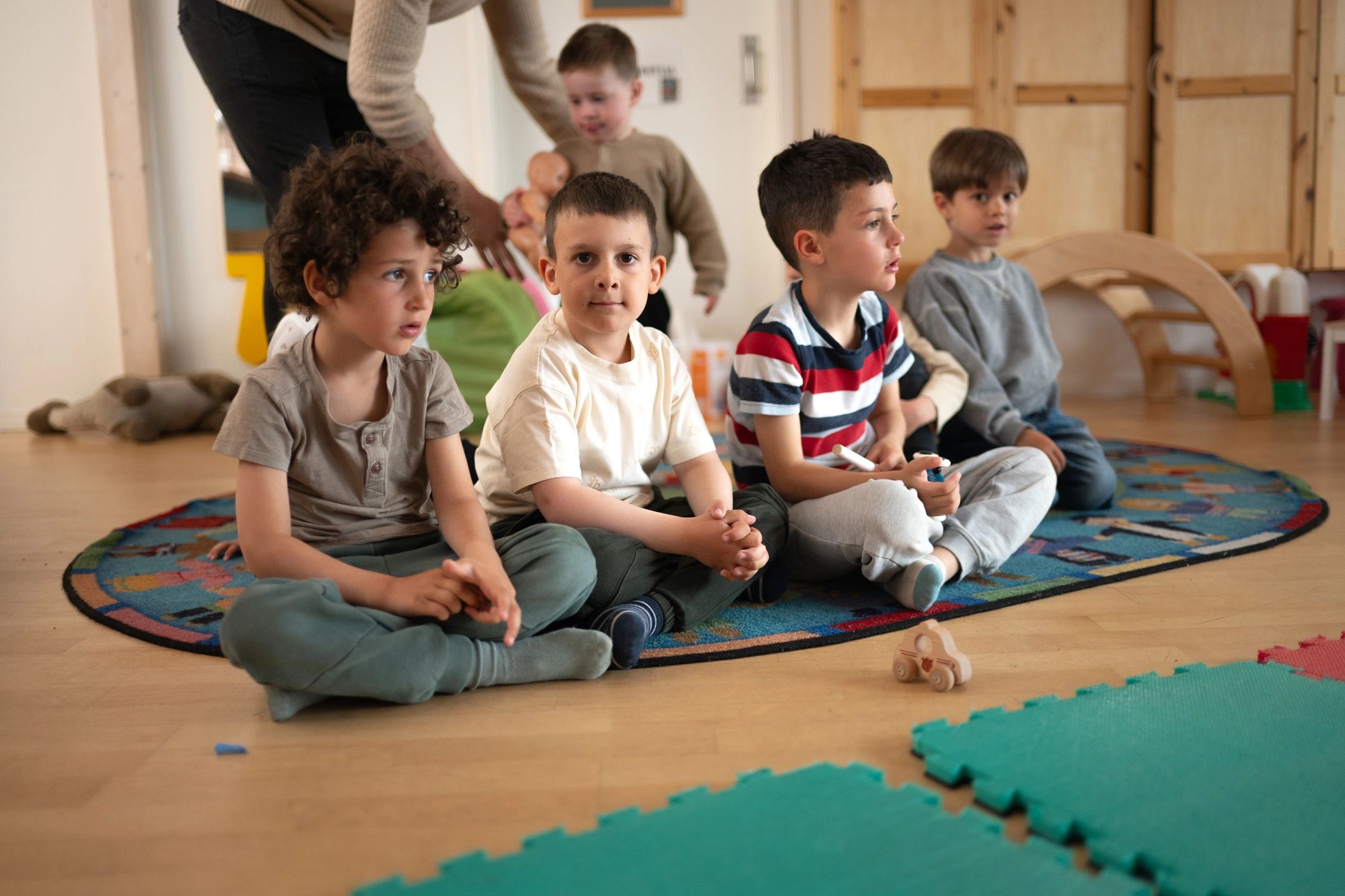 Teacher guiding preschool children during circle time at Blossom Montessori Care and Preschool